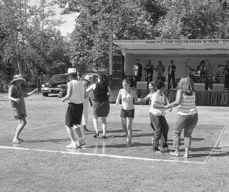 Ventura County residents, decorated with memorial mardi-gras beads, swing dance to the southern jazz of Porterhouse Bob at Rancho Simi Park, celebrating the fundraiserÂ´s fantastic turnout.