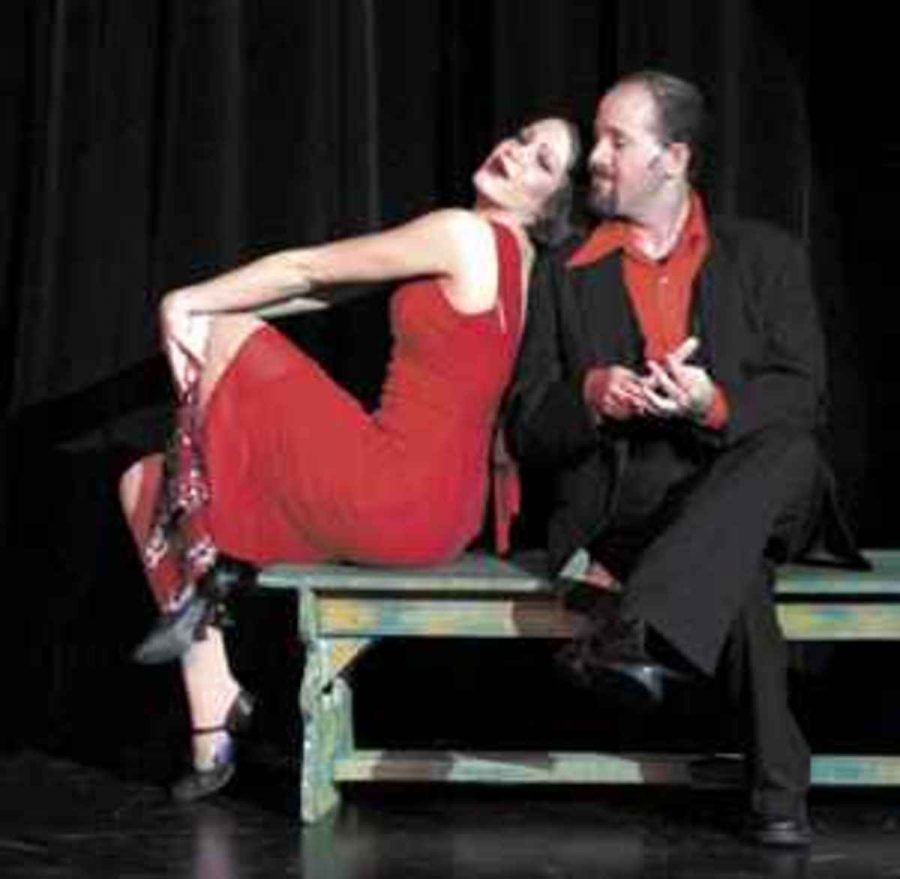 Jeff Wallach, bottom right, plays a devilish Mr. Applegate and is accompanied by fellow cast member Elizabeth Garcia who takes on the role of the seductress, Lola.