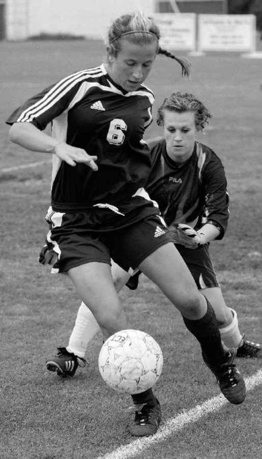 Lady Raider Mary Vercher, front,  plays keep away from Allan Hancock CollegeÂ´s Allison Brackeen.   Moorpark is having a great season with a  11-2-3 record.