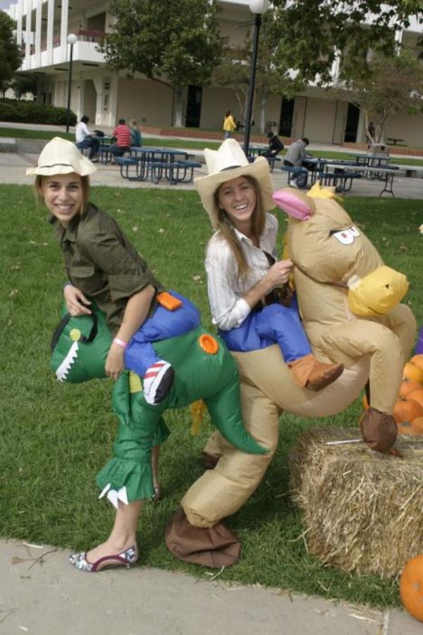 AS Director of Public Relations Tanya Pulley, 19, left, and AS President Kasey Crispin, 20, right, strut their stuff at Club Day. 