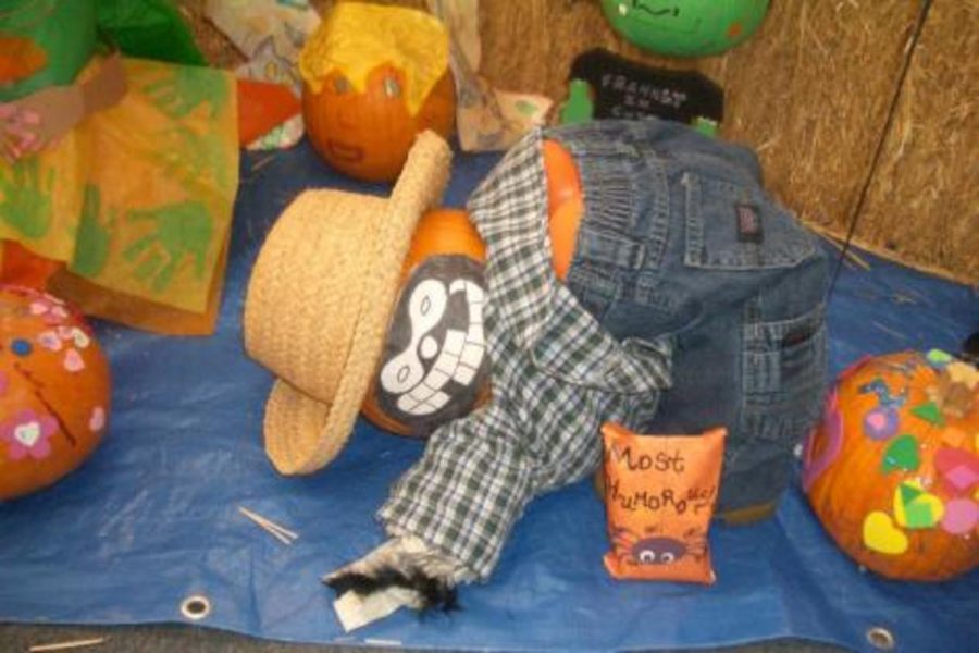 The Oxnard College bookstore staff won an award for the humorous pumpkin, shown mooning above.