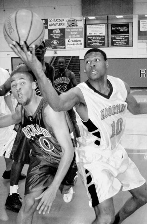 Raider forward Mike Hayes drives past OxnardÂ´s Marcus Warren to attempt a layup is Saturday nightÂ´s 112-72 victory over the Condors.