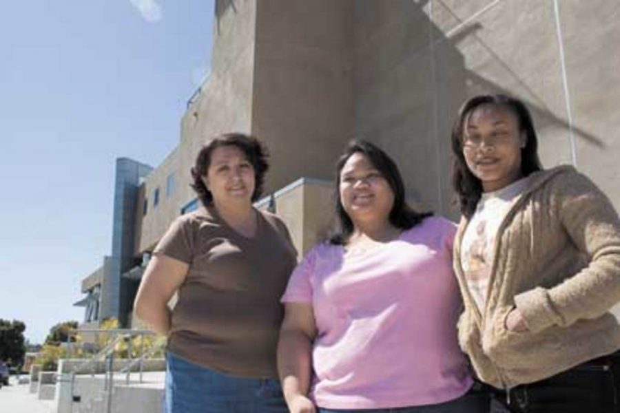 Nursing students Adelina Garcia, 29, Rosylynn Pecatoste, 21, and Shamelia Maharaj, 24, wait for the test results outside the library at Ventura College which celebrates its 80th anniversary on March 18