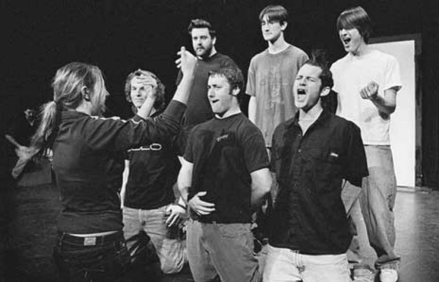 Vanessa Cate, 19, directs an improvised human orchestra composed of her fellow "One Shot Comedy" cast members on March 4 at Moorpark College.