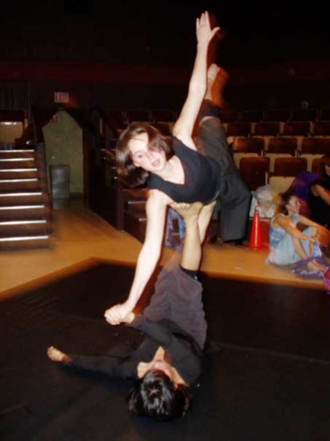 Brianna Manson, top, and Candice Cunningham practice a dance technique at the ACDFA dance competition and conference.