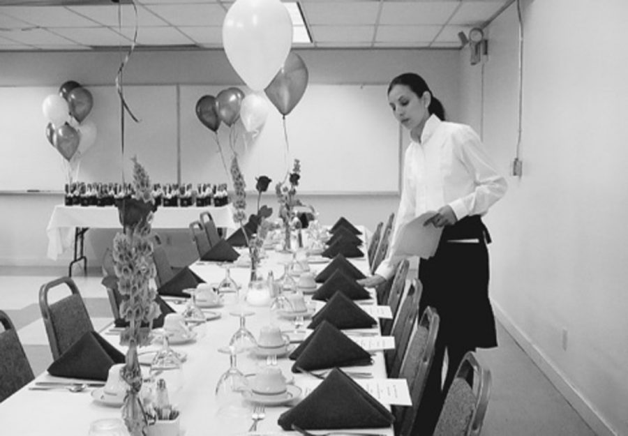 Oxnard College culinary arts students help in preparation by setting menus for a banquet at the Wild Goose Restaurant, which is located in room OE11 at Oxnard College. Lunch is available by reservation only.