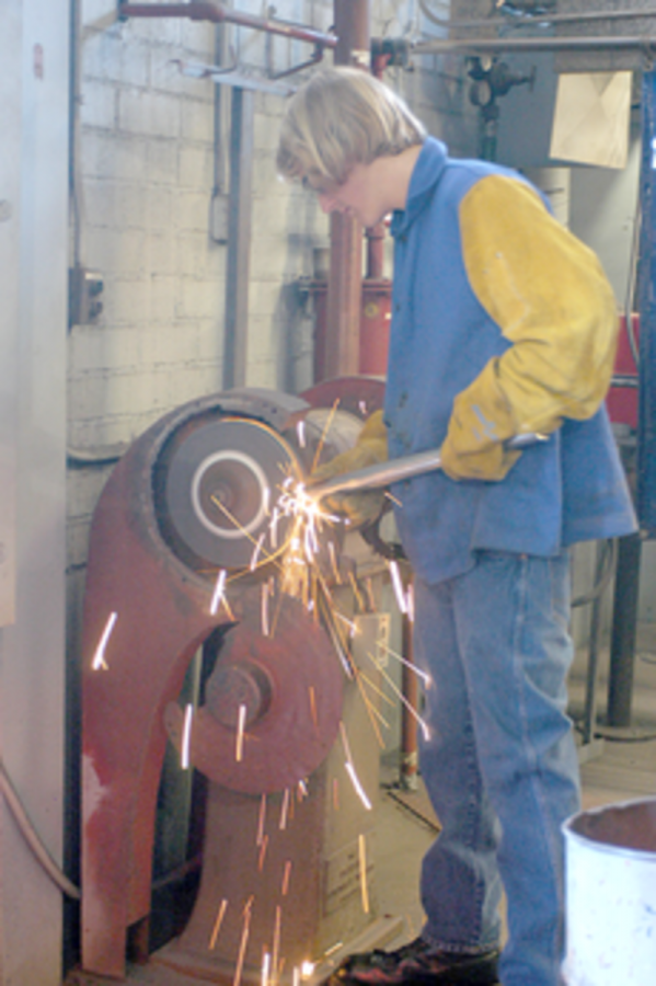 Roger Geer, 66, works on a mount that will fit a 14-inch telescope.