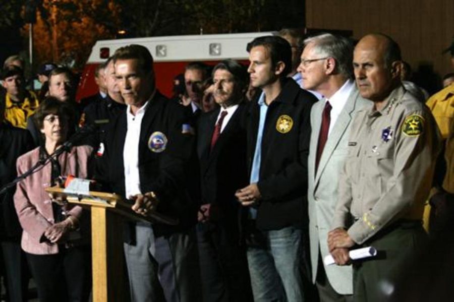 Governor Arnold Schwarzenegger (second from left) and key local leaders brief the media on the status of the Southern California fires in a press conference held in Santa Clarita on Oct. 24.  Pictured left to right
