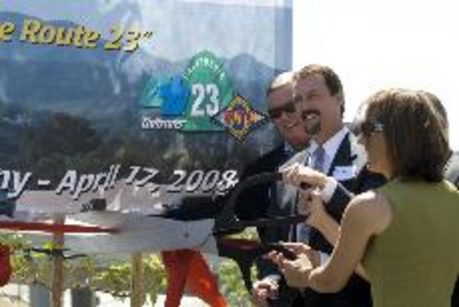 Ventura County Supervisor Peter Foy, center, and Thousand Oaks Mayor Jacqui Irwin officially declare the newly widened 23 Freeway open with a ceremonial ribbin-cutting.