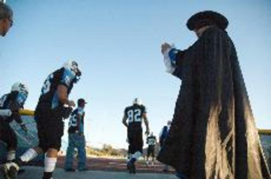 The Raider motivates the Moorpark College Raiders football team prior to their game against Fullerton on Saturday night. 