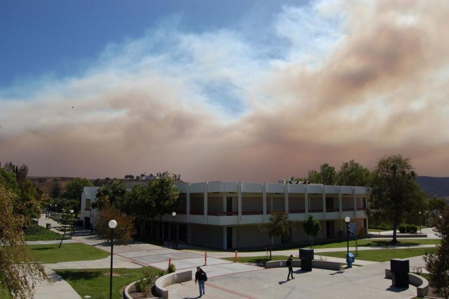 Smoke from the northern LA County brush fires fueled by the Santa Ana winds loom over Moorpark College on Monday at 1 pm.  