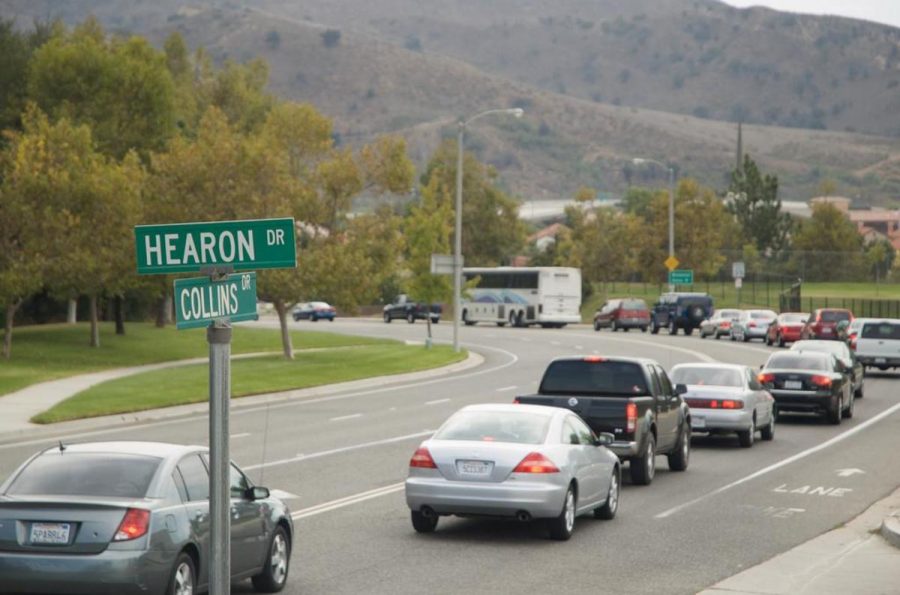 Cars, trucks and the bus on Collins drive back up several times during peak traffic hours.