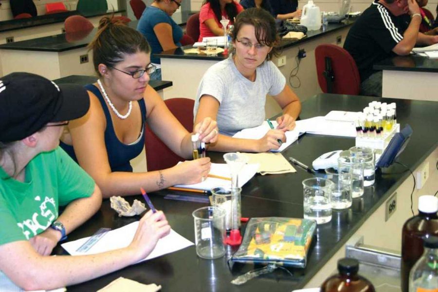 Sally Smith, left, Jerrica Huling, center, and Jennifer Foster work on a diffusion experiment in Biology class at Oxnard College. OC received a $2.5 million grant for Science, Technology, Engineering, and Math. 