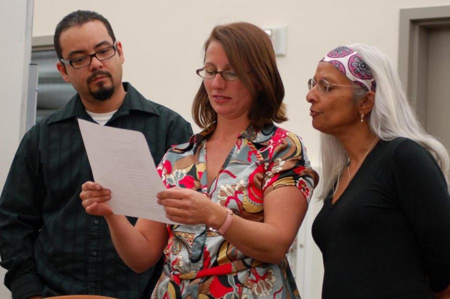 F. Albert Salinas, Mary Sagala Verleur, and Sandra Hunter perform a poem they wrote together at the poetry read on Wednesday evening Nov. 12 at Moorpark College.