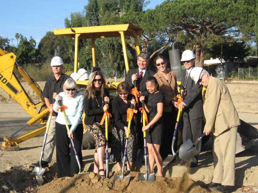 From Left to right, Dave Keebler, Joan Beem, Christy Weir, Cheryl Heitmann, James Mezneck, Nancy Pham, Steve Blum, and Larry Miller break ground in the ceremonial first shovel. 