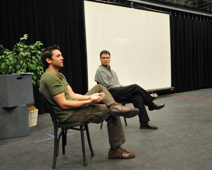 Stuntman Kevin Foster, left, speaks with Professor John Lopreino, right, and students in the PACs Black Box about working in show business. Foster has worked at theme parks across the U.S. and in action films such as Iron Man.