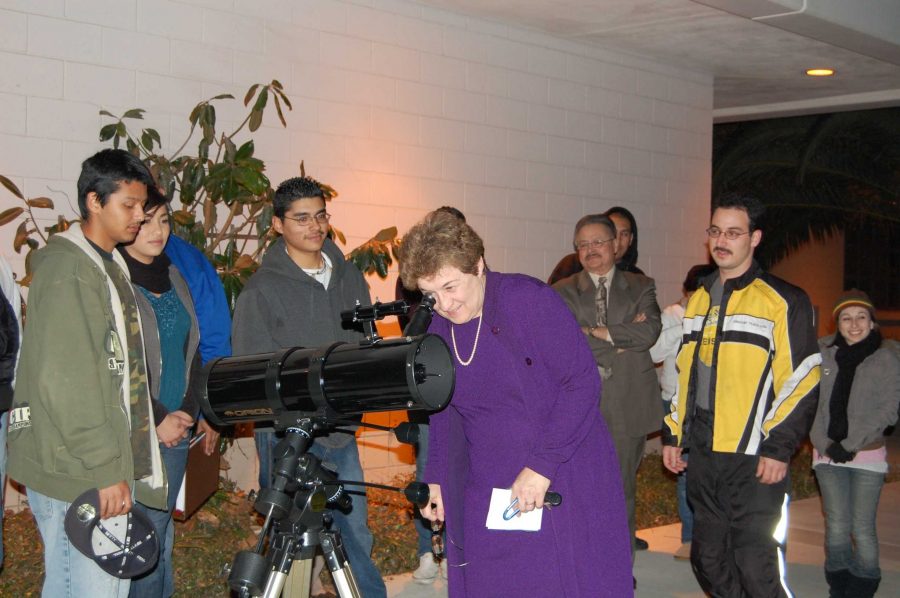 Donna Gustafson views the half-moon on the telescope she donated to the Oxnard College astronomy program on behalf of her late husband, Henry