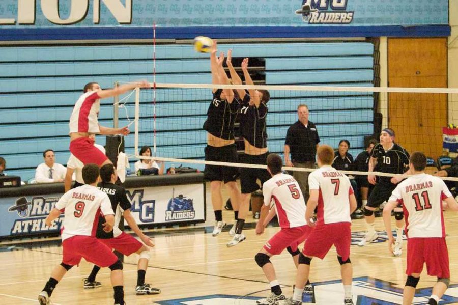 Moorparks middle blocker No. 15 Ben Spielman and outside hitter No. 11 Dominic Denham go up for the block in Wednesday nights showdown against Pierce.