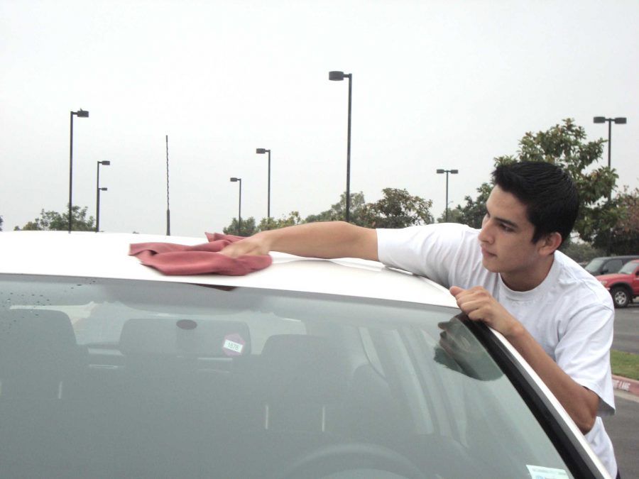 SHPE member Ricardo Gaytan washes cars to help earn money for his trip to Washington D.C.