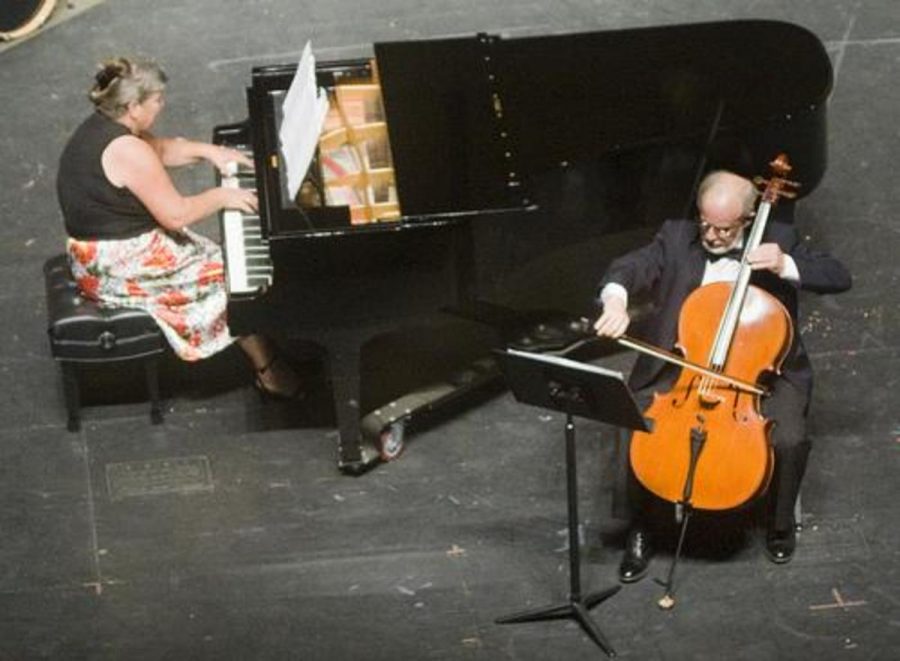 Christine Deklotz plays the piano while Stephen Custer draws his bow across his cello at A Musical Offering on Sept. 9.