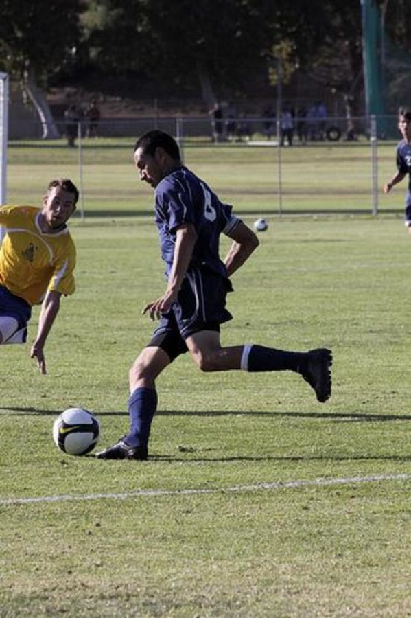 Moorpark Raider, Jose Garcia, guides the ball past Allan Hancock College Bulldogs, Moorpark won 3-1, on Tuesday, Oct. 6, 2009.