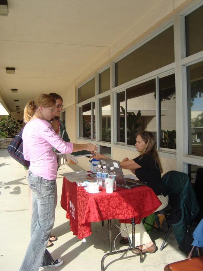 Joan Winton, a rep from the United Blood Services, hands out flyers to interested donors.