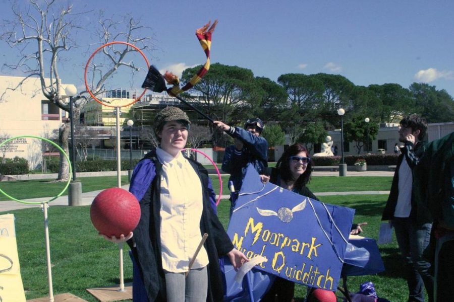 Cambria Wells, left, and Arianna De La Mora, vice president of Moorpark Muggle Quidditch disarm passersby with their Beater physiques while Chaser Bryan Bujanda tries to grab the attention of his fellow muggles at Moorpark College’s Club Day on Feb. 22. 