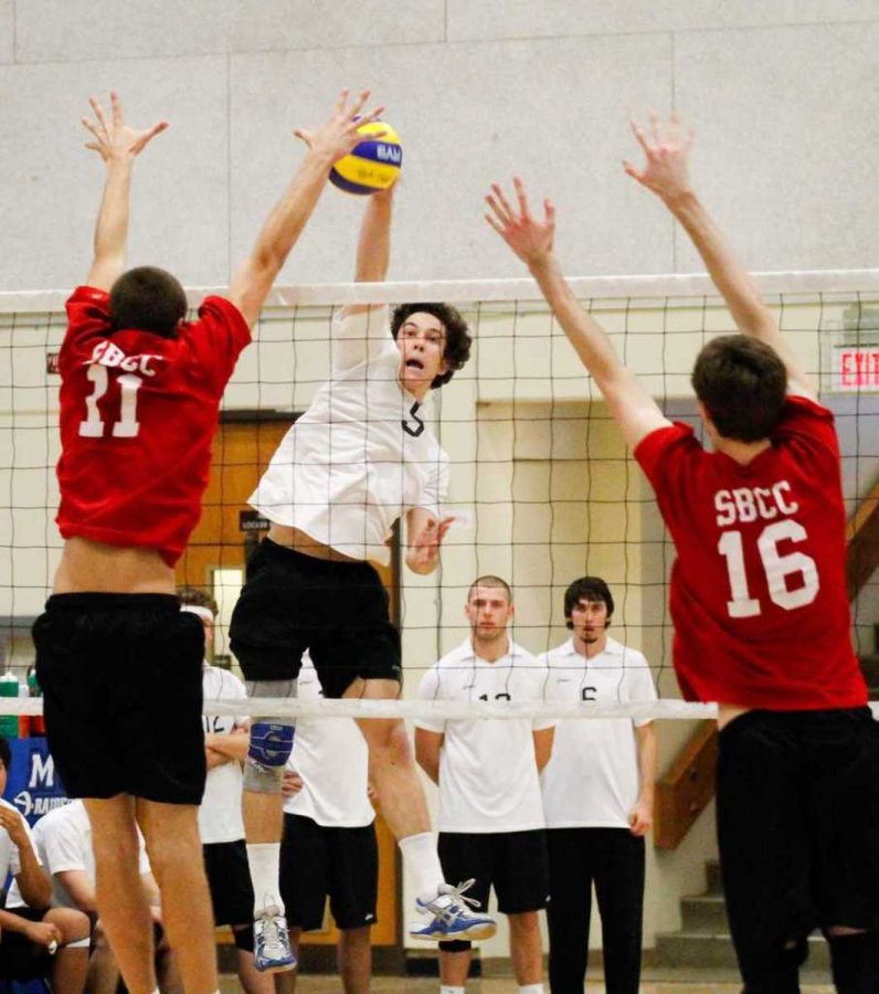 Moorparks Josh Howley goes in for the kill as Santa Barbaras Miles Evans (No. 11) and Justin Hertlein (No. 16) defend. 