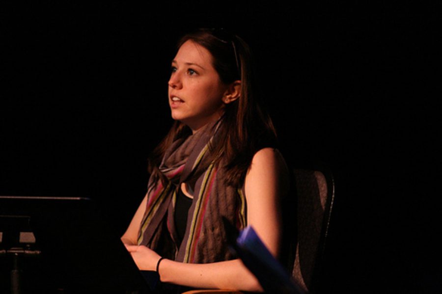 Actress Meredith Dilg performs a scene from the play for a small audience in MCs Black Box Theatre