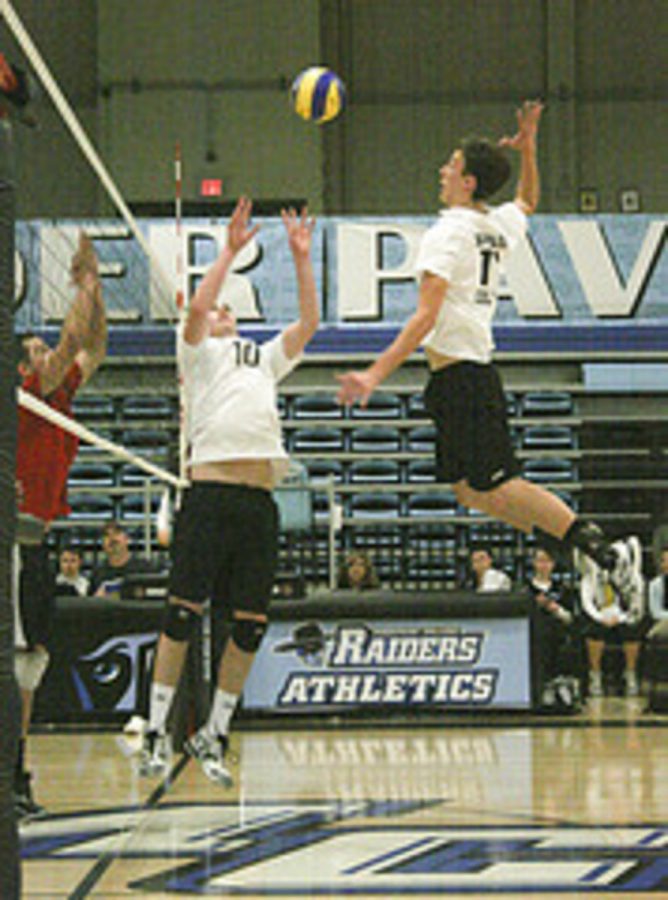 Moorparks Adam Quinn sets up a kill for the Raiders Kyle Auge in a conference opener against Long Beach City College. The Raiders were swept in three sets Friday night at Raider Pavilion.
