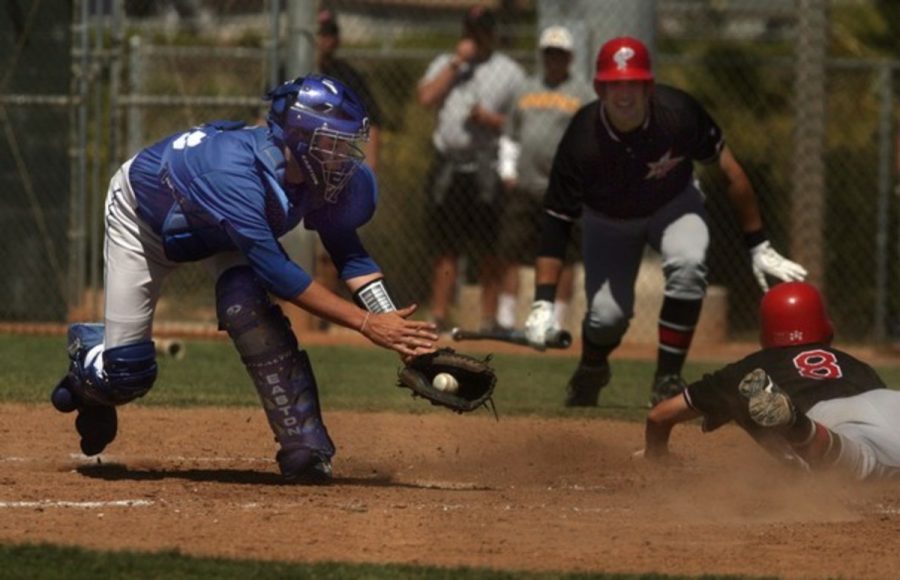 Palomar Colleges Ty Afanir slides home safely before Oxnard catcher Zack McDonell can apply the tag during the Southern California Regional game at Oxnard May 7.
