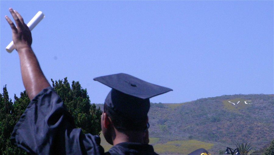 A Ventura College Grad says his final goodbye to his college while the Ventura College initials watch on like a guardian on the mountains overhead. 