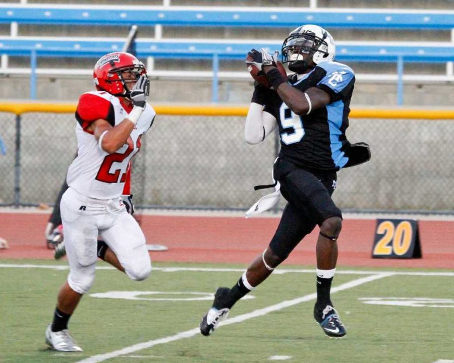 Raider Chris Gant receives the ball over a Vaqueros defender at Griffin Stadium on September 25, 2010. Gant scored twice in the Raiders 35-29 win.