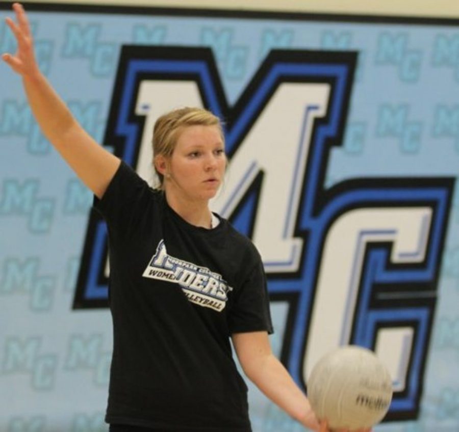 Chelsy Westphal,sophmore, middle blocker readys to serve to her team at practice 