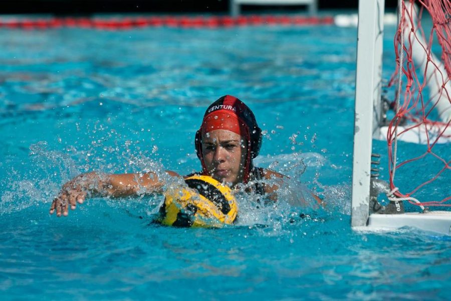 Goaltender Andrea Mallul, with intensity gathers up a rebound off a save 