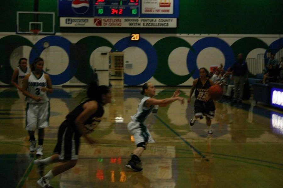 Pass it on- Point gaurd Corteny Robbs passes the ball to Nikki Tauau(not shown) for one of her two three-pointers on Nov. 6.The Condors won 63-60.