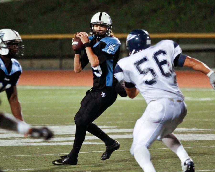 To be or not to be-Raider Zach Shultis drops back to pass over a Citrus Owl defender at Griffin Stadium on Nov. 6. The Owls won the game 20-15.