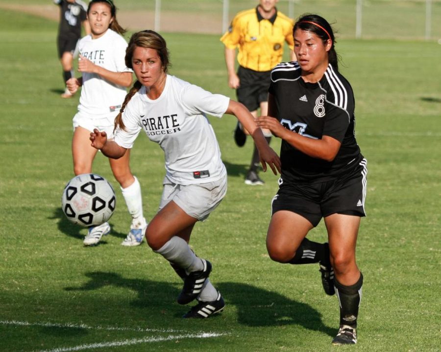 Determination-Pirate Hope Weber and Raider Liz Meza compete for the ball at Raider Field on Nov. 5. The Pirates won the match, 2-1.