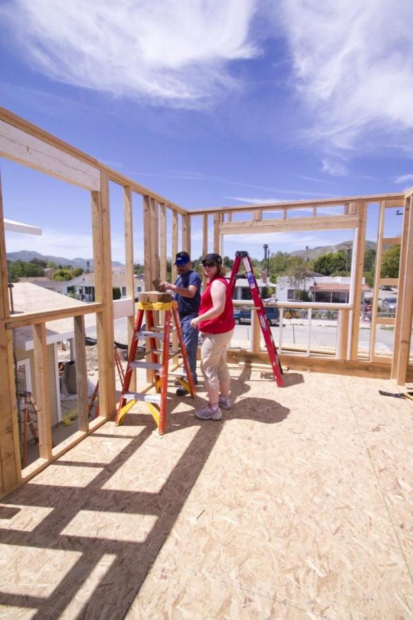 Amaya and Zach Silber help build a house for a needy family in Piru. 