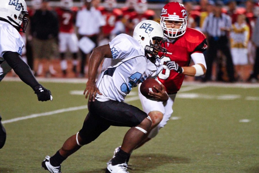 Raider William Franklin runs past Brahma Brandon Smith at Griffin Stadium on September 10, 2011. The Raiders won the game, 54-7. 