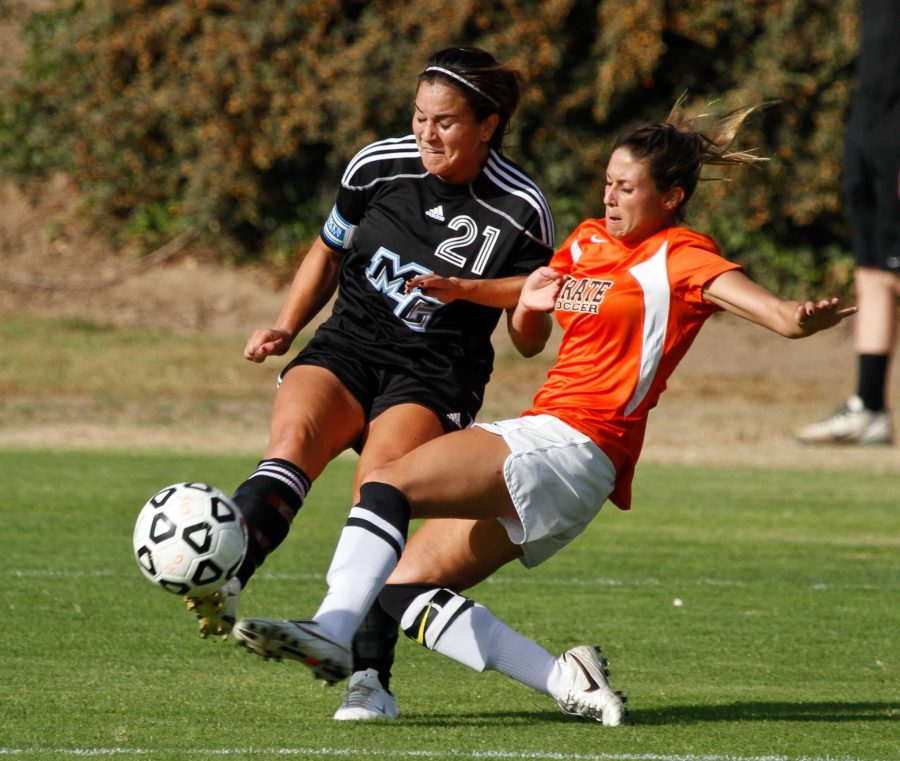 Raider Marylin Alvarez gets a shot off against a Pirate defender at Raider Field on Sept. 30, 2011. Alvarez scored twice but the the Pirates won the match, 6-2. 