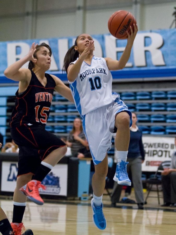Moorpark College Raider Ashley Samson  gets by Ventura Pirate Stephanie Ramirez for the go-ahead basket with less than 2 minutes left in the game at Raider Pavilion on Jan. 25, 2012. The Pirates won the game 52-48.