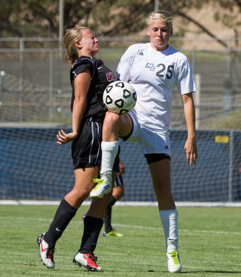 Moorpark College Lady Raider Kaija Fortuna, 25, competes against a Santa Ana College Don defender at Moorpark College on Tues.,August 28, 2012. Fortuna scored in the 17th minute and Moorpark won the match 3-0. -Photo by Jeff Farrar