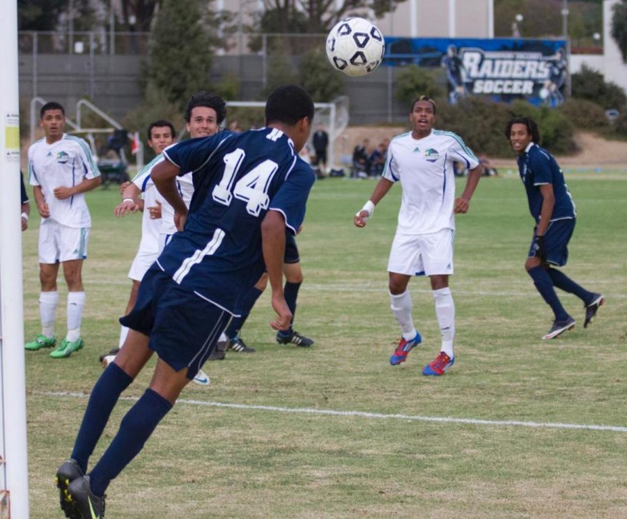 Moorpark Raider Edgar Hernandez, 14, headbutts the soccer ball in a game vs Oxnard college. The Match ended in Moorpark's defeat 0-2. Photo By Brittany Tackett