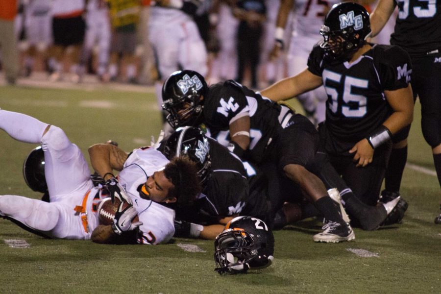 Ventura College Pirate, Kendall Worth (#21) looses his helmet after getting tackled by Moorpark College Raiders. Photo By Sam Mora