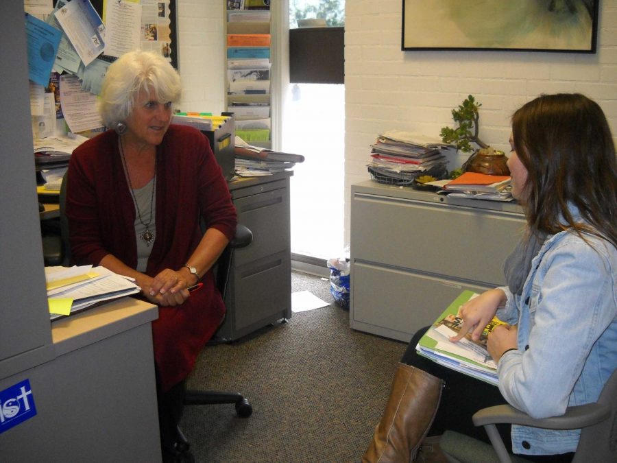 Career Transfer Center coordinator  Judi Gould, counsels Felicity Holman, 19, Kinsinology major, on her future plans after moo park College.