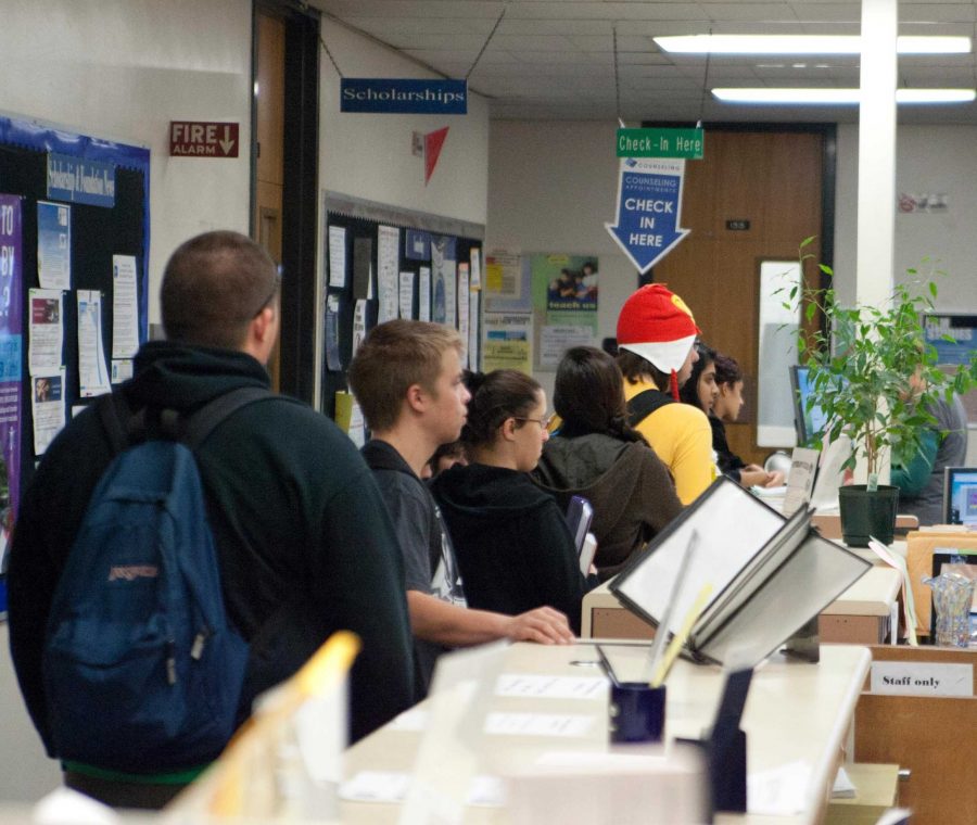 Moorpark students wait in line, to meet with counselors on Nov. 13, 2012. They are looking to get consultation about their classes so they can register for their next semester. -Photo by Sam Mora