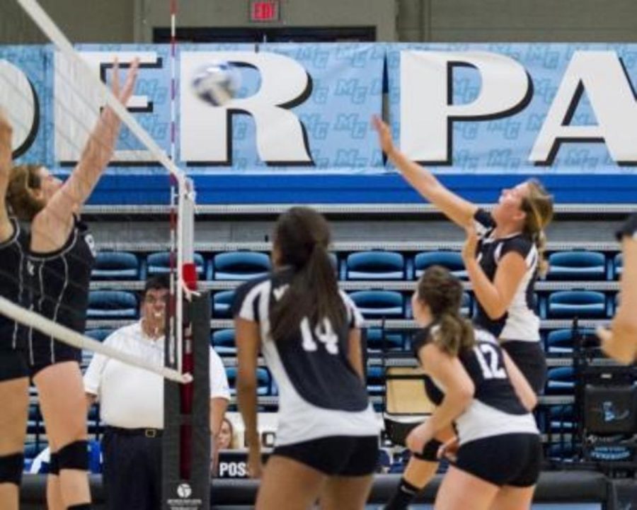 Gabriella Luciani, MB, hits the ball over to Cuesta on Nov. 2. 