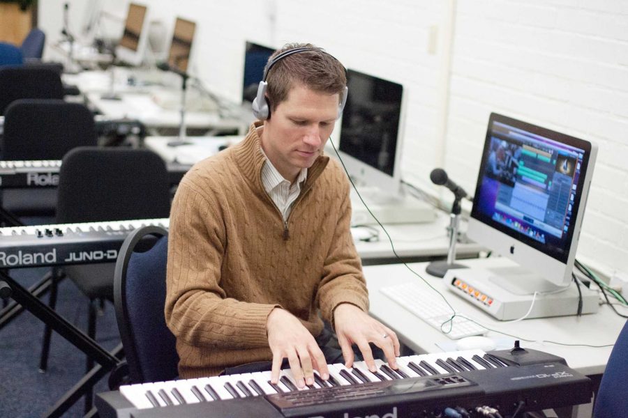 Professor Nathan Bowen works on his music.