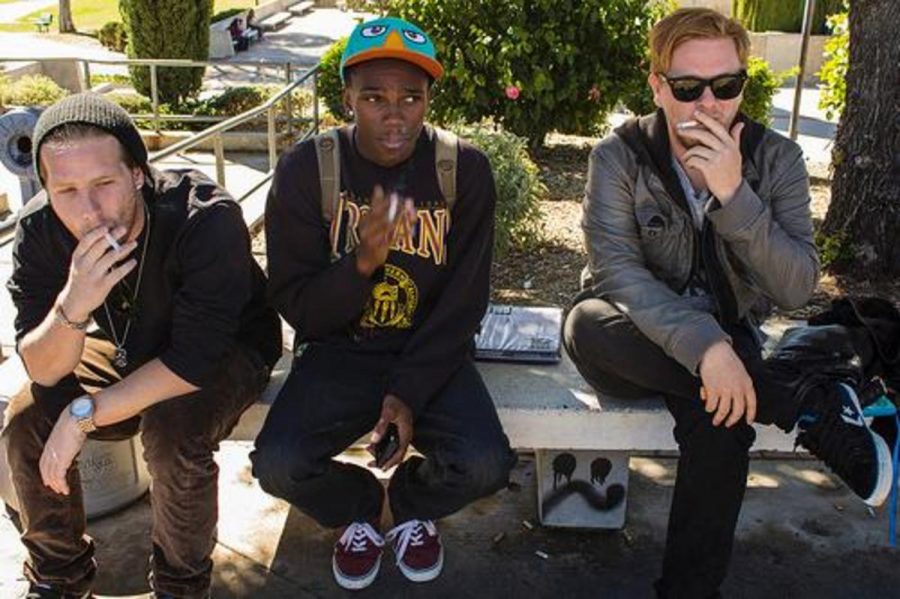 P.J. Baxter, Cedrick Austin, and Kevin Kossow socialize and enjoy a cigarette between class.